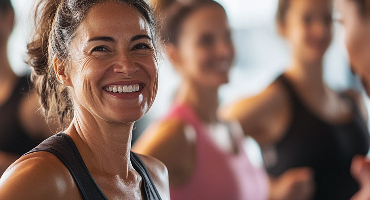 Women exercising with healthy foods around them.